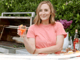Gaby Dalkin holding drink at an outdoor grill, in her backyard