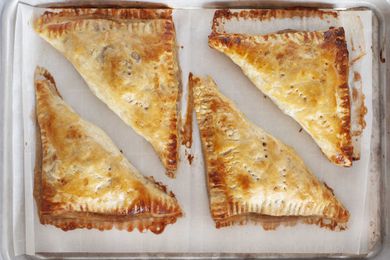 Turnover recipe shows apple turnovers baked on a sheet pan.