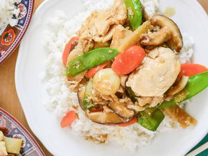 Moo Goo Gai Pan Chicken on a white plate with rice