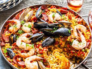 Finished seafood paella from the grill in a skillet ready to serve