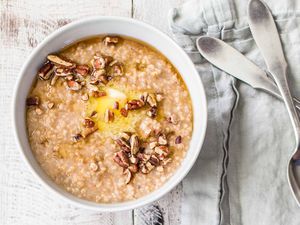 Instant Pot Oatmeal with apples and cinnamon in a bowl with silverware nearby