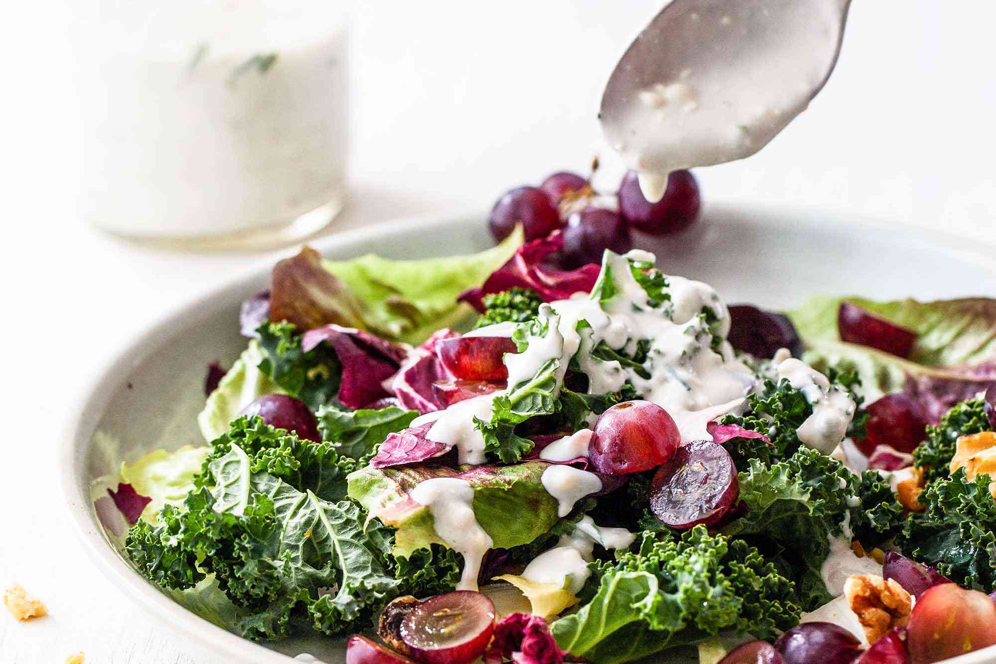 Mixed Green Salad -- colorful salad in a bowl with blue cheese dressing