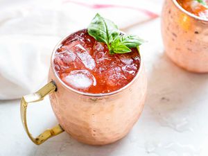 Summer Moscow Mule with Strawberry closeup of strawberry moscow mule with basil garnish