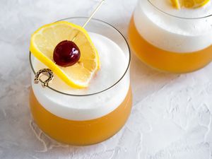 Amaretto Sour Garnished with Lemon Slice and Cherry