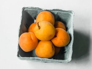 Apricots in a cardboard container