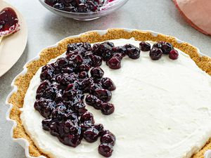 Whole Blueberry Ice Box pie with blueberries on the top.