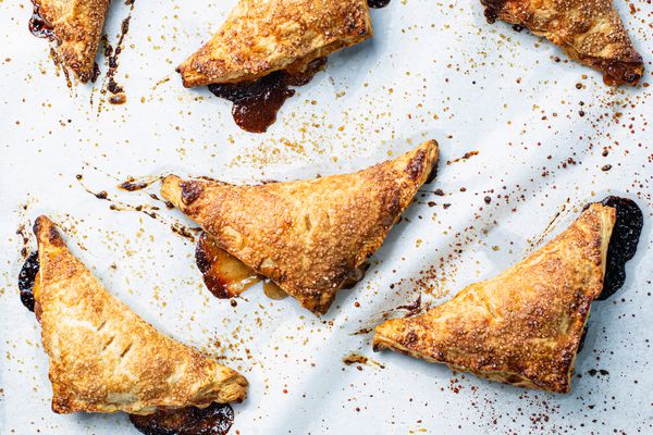 Peach hand pies on parchment paper