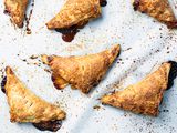 Peach hand pies on parchment paper