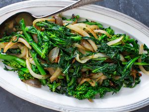 Broccoli Rabe and onions served on a platter.