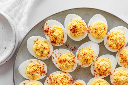 Overhead view of a platter of Classic Deviled Eggs.