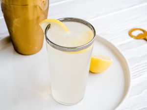 Glass of Gin Fizz with Lemon Slice on Tray