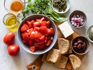 Ingredients in bowls to make Authentic Cretan salad.