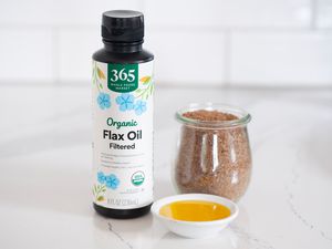Flax oil bottle with glass jar of flaxseeds