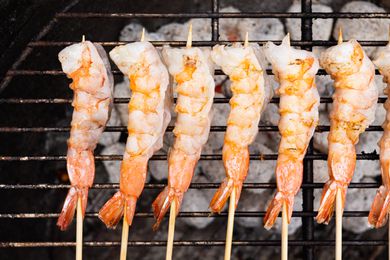 Overhead view of grilled shrimp skewers.