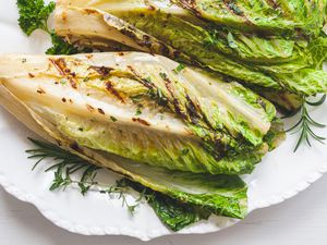 A platter of whole romaine in a romaine salad.