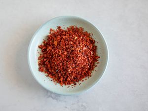 Aleppo pepper flakes in a light blue bowl