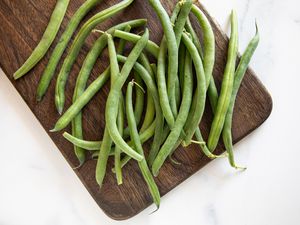 Green beans on a wood cutting board