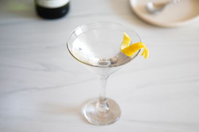 50/50 Gin Martini with a lemon peel garnish.