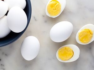 Hard Boiled Eggs - Some Cut in Half, Some in a Bowl