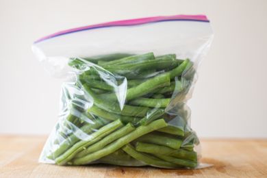 Trimmed green beans in a plastic ziptop bag