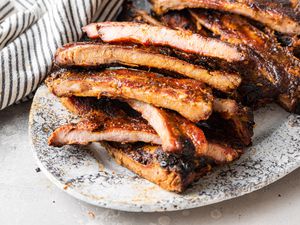 Memphis-Style Pork Ribs Cut into Pieces on a Platter