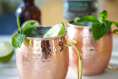 Close up of two Moscow Mule Cocktails garnished with mint.
