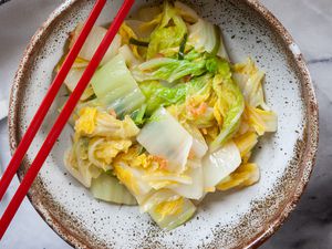 Napa Cabbage with Dried Shrimp in a bowl with chopsticks.