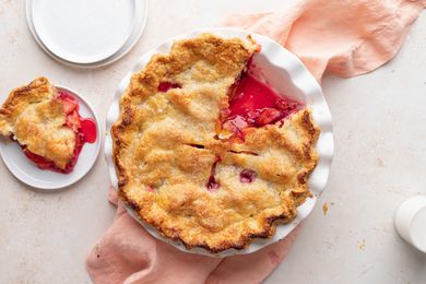 Overhead view of a summer peach and raspberry pie.