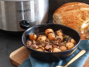 Lamb Stew with Pomegranate Molasses in a bowl with bread.