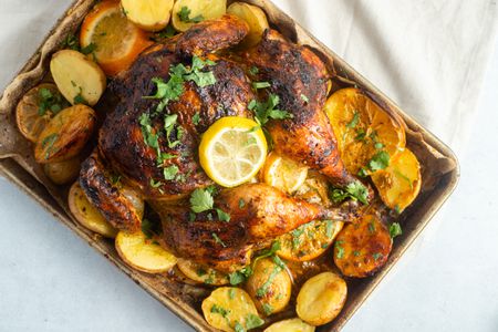 Roasted Spatchcock Chicken with Harissa, Herb Yogurt, and Citrus
