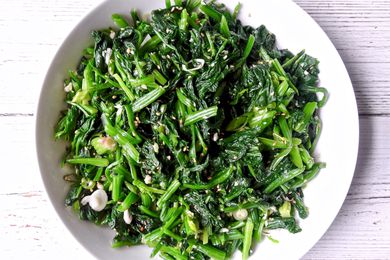 Toasted sesame and garlic spinach in a white bowl.