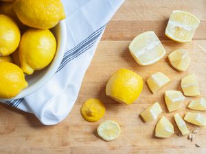 Chopped lemons on a cutting board.